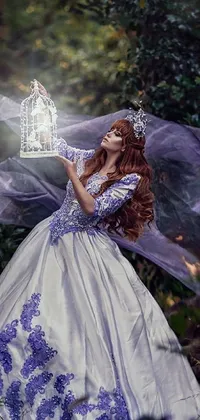 This phone live wallpaper features a stunning woman in a wedding dress holding a birdcage in an enchanting forest
