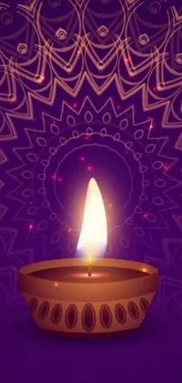 This stunning live wallpaper features a beautiful lit diya, a traditional Indian oil lamp, against a vibrant purple background