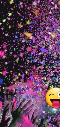 This phone live wallpaper features a festive scene with people throwing confetti in the air