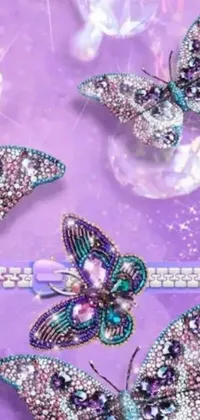 This live wallpaper features a vibrant display of colorful butterflies resting on a luxurious and elegant purple table adorned with stunning jewelry, including Swarovski and Tiffany