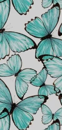 This phone live wallpaper features a stunning art nouveau design, with a pale cyan and grey fabric background