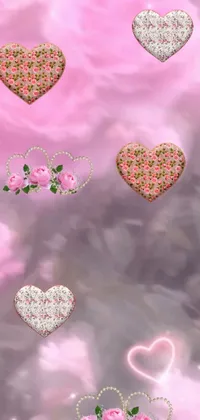This live wallpaper features a plethora of hearts in various hues and sizes against a pink gradient background