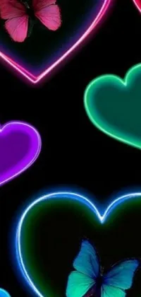This lively phone live wallpaper features colorful hearts on a black background, complemented by green neon signs and vibrant purple and blue neon lights