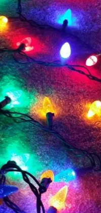 This phone live wallpaper features a mesmerizing bunch of colorful lights on the ground, backlit to enchant your device screen