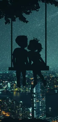 This live wallpaper displays a heartwarming scene of a couple of teddy bears on a swing against a charming cityscape in silhouette