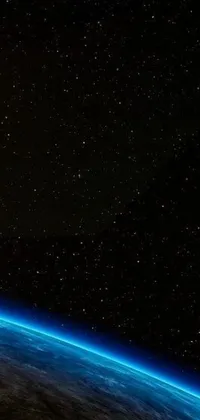 This phone live wallpaper features an incredible view of the Earth from space with city lights illuminating the planet