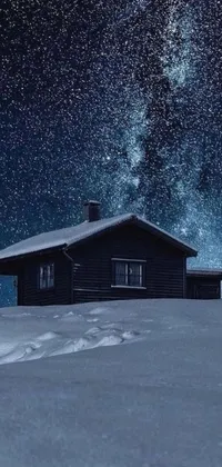 Immerse yourself in the winter wonderland with this live wallpaper depicting a cabin atop a snow-covered slope