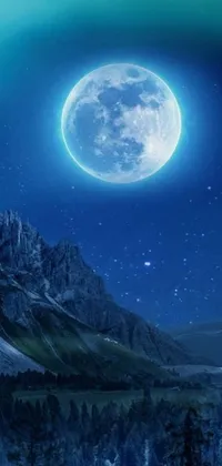 This live wallpaper features a stunning digital image of a full moon against a mountainous background with a snowy hill and silhouetted tree in the foreground