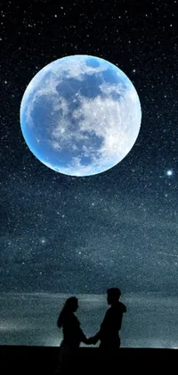 Beautiful live wallpaper for your phone featuring a romantic couple holding hands under a full moon