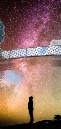 This phone live wallpaper showcases a bridge above a river that glows warmly and crosses a river