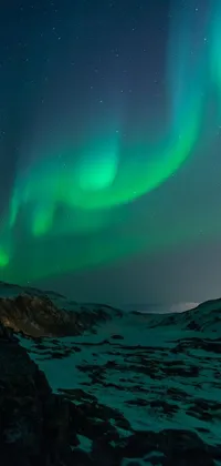 Get mesmerized by this stunning phone live wallpaper featuring the beauty of the aurora borealis or Northern Lights