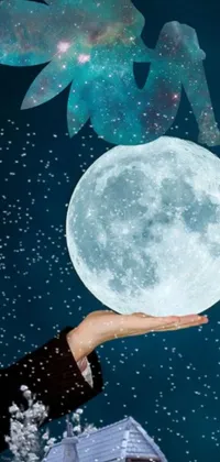 This incredible phone live wallpaper depicts a stunning scene of a person holding a mystical moon in their hand