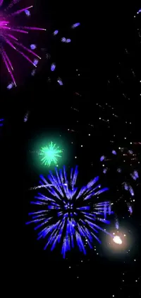 This phone live wallpaper shows a digital rendering of vibrant fireworks bursting in different directions against a black background
