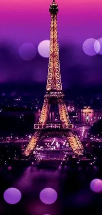 Looking for a new phone wallpaper? Look no further than this digital masterpiece! This live wallpaper features the illuminating Eiffel Tower at night, set against a cluster of city lights and an alluring purple bokeh