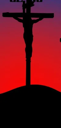 This live phone wallpaper features two crosses set against a blood-red background on top of a hill