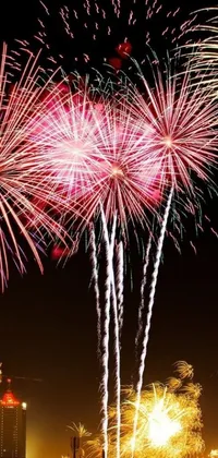 This live wallpaper for iPhone 15 features a dynamic and colorful display of fireworks in the night sky