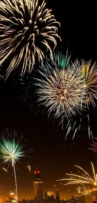 Looking for a stunning live wallpaper for your phone? You can't miss this colorful and mesmerizing fireworks display that lights up the night sky with its vivid shades