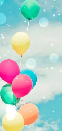 Looking for a fun and playful phone wallpaper? Check out this vibrant and colorful live wallpaper featuring a bunch of balloons floating in the air