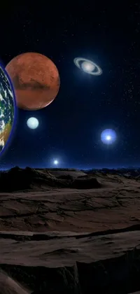 This mesmerizing live wallpaper features a group of planets, barren earth, planet mars, stars, and moons