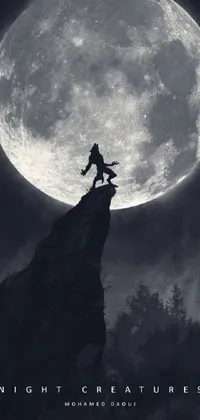 This phone live wallpaper showcases a majestic man standing on a mountain top under a glowing full moon