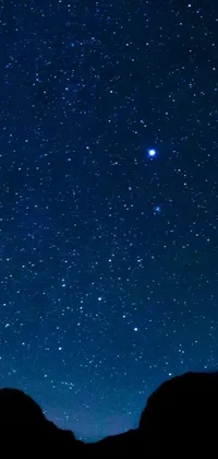 This mobile live wallpaper features a night sky filled with twinkling stars, including Sirius A and Sirius B