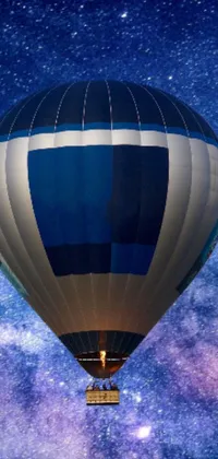 This live wallpaper features a blue and white hot air balloon floating in deep space, surrounded by a full-view silver galaxy