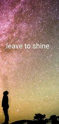 This captivating phone live wallpaper is a minimalist masterpiece featuring a solitary figure on a hill gazing at a starry sky in utter amazement