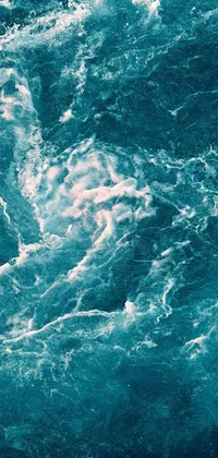 Experience the thrill of riding an ocean wave with this stunning live wallpaper for your phone