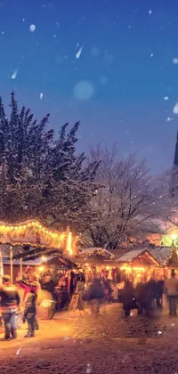 This lively phone live wallpaper captures a winter wonderland scene of a snow covered street crowded with people and market stalls in a happening festival setting