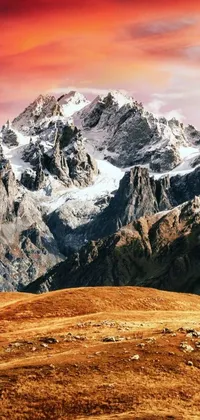 This phone live wallpaper features a herd of sheep on a lush hillside surrounded by the breathtaking Himalayas