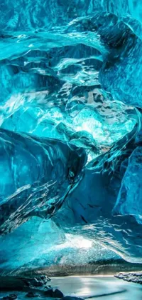 This phone live wallpaper showcases the stunning interior of an ice cave in Iceland
