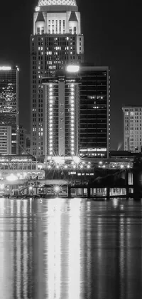 This stunning black and white phone wallpaper captures the captivating beauty of a bustling city at night