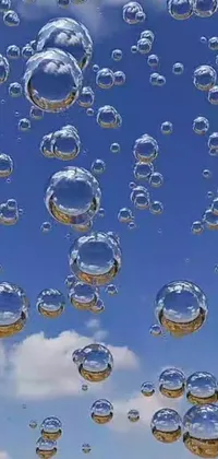 This live phone wallpaper showcases a captivating scene of bubbles floating in the air