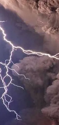 This phone live wallpaper boasts a dramatic and mesmerizing scene of a mysterious, dark cloud enveloped in lightning bolts that flash in the background of a magnificent mountain landscape