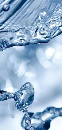 This phone live wallpaper showcases a picturesque water wave close-up
