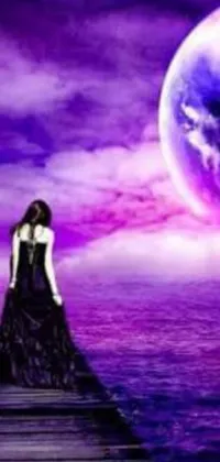 This purple-themed phone live wallpaper shows a woman standing on a dock under a moon picture