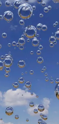 This phone live wallpaper features a captivating display of bubbles swaying in the air and dissolving in a hypnotic pattern
