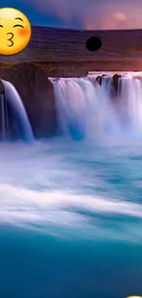 Bring the beauty of nature to your phone with this captivating live wallpaper! Featuring a stunning waterfall and a duo of emoticons soaking in the beauty of the surroundings, this wallpaper brings a sense of serenity and tranquility to your screen