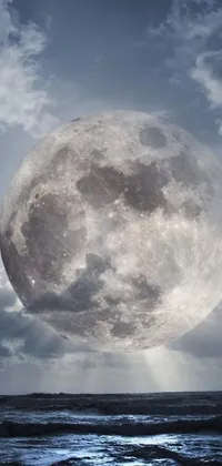 This ocean-themed live wallpaper is perfect for your phone! Created by Pexels, this surreal rendering shows a full moon rising over cloudy waves