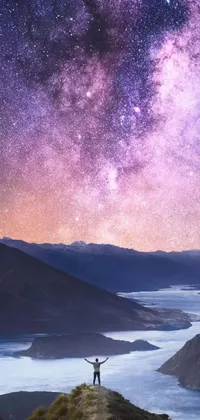 This stunning live wallpaper features a majestic landscape of rolling hills and a sparkling lake set against a purplish, star-filled sky