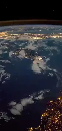 This live wallpaper showcases a stunning view of the earth at night from space