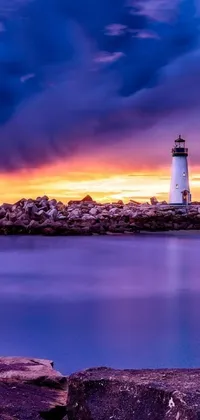 This dynamic live wallpaper depicts a visually stunning lighthouse situated in a serene body of water