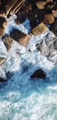 This phone live wallpaper showcases exquisite scenery of water surrounded by rocky terrain