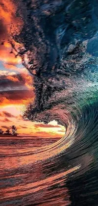 This live phone wallpaper showcases a stunningly beautiful image of a wave crashing into the ocean at sunset