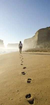 Experience the tranquility and beauty of walking along a Melbourne beach with this stunning live wallpaper