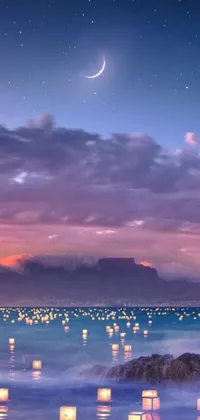 This live wallpaper features a tranquil scene of lanterns floating on water in South Africa