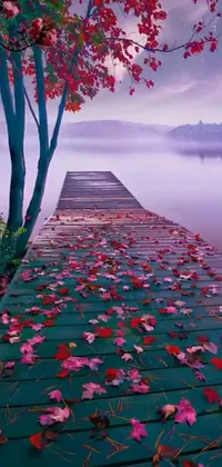 This phone live wallpaper features a dock with fallen leaves, a photorealistic painting, and pink fog background
