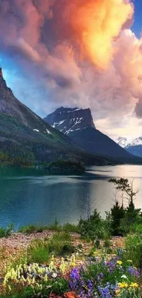 This phone live wallpaper showcases a stunning landscape of a serene body of water, complimented by towering mountains