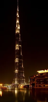 Enjoy a stunning phone live wallpaper featuring Burjra Tower, taken at night by Bernardino Mei in 2012