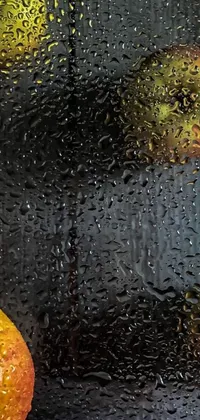 This stunning phone live wallpaper features a photorealistic painting of fresh fruit resting on a rain-soaked window